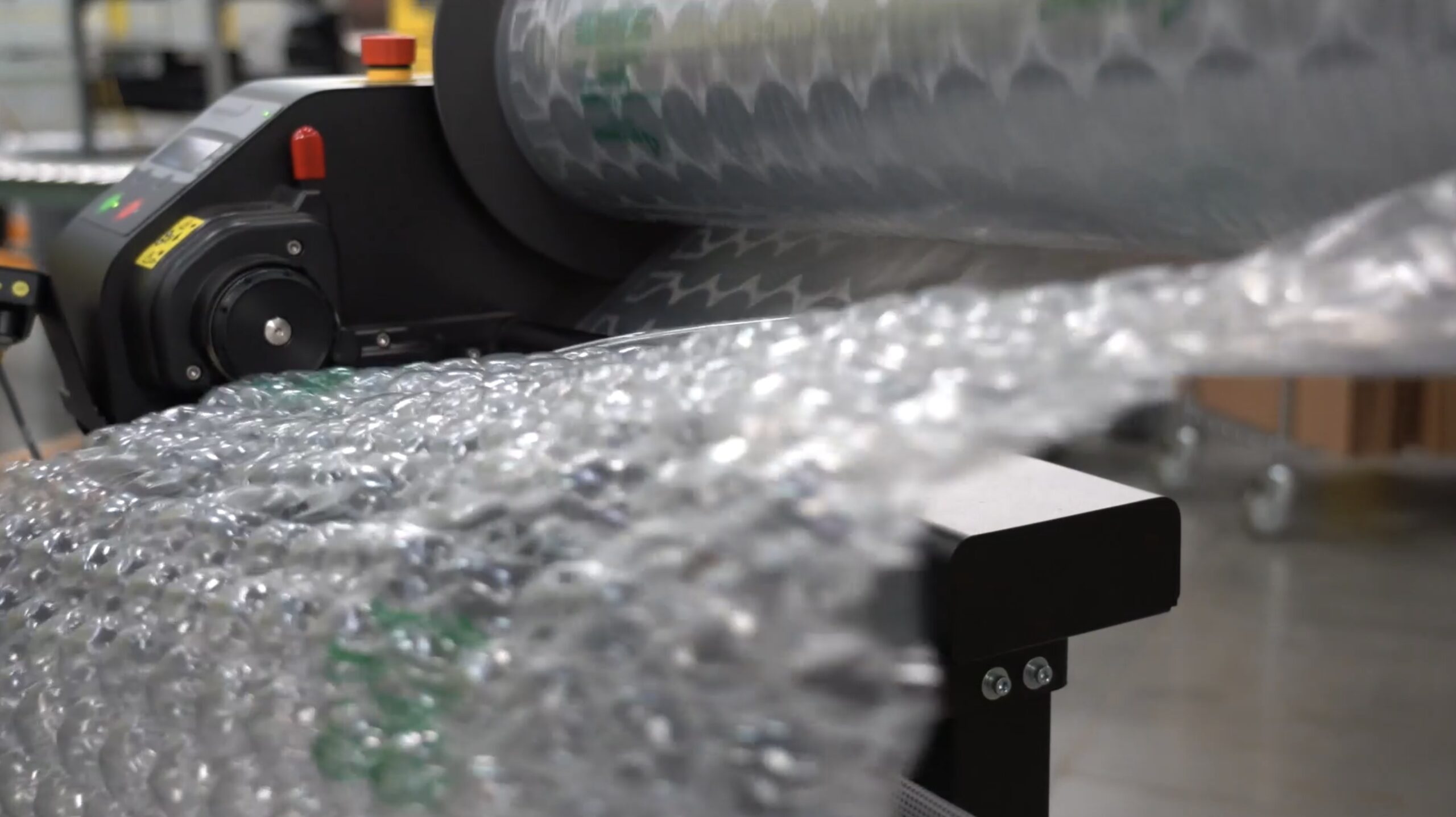 On-location industrial video production capturing high-speed machinery and distribution center operations.